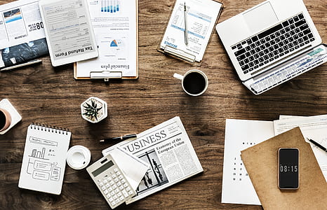 white mug on top of table near laptop and smartphone thumbnail