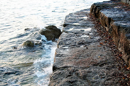 gray concrete block in front of sea thumbnail