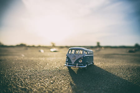 selective focus photography of white and blue Volkswagen T1 van die-cast model thumbnail