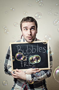 man showing Bubbles for free signboard thumbnail