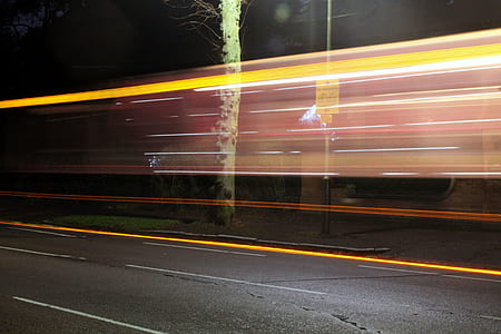 timelapse vehicle taillight near tree thumbnail