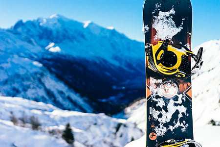 black, yellow, and orange snowboard thumbnail