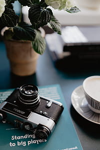 Old analog camera and photography book thumbnail