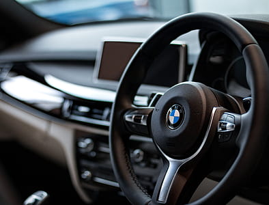 shallow focus photography of black BMW car steering wheel thumbnail