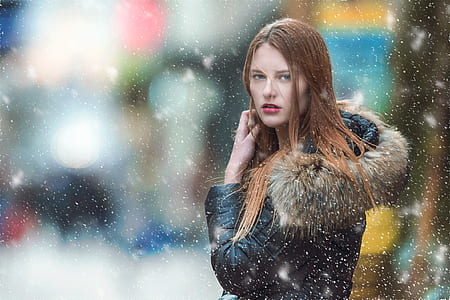 selective photography of woman in black and brown parka hoodie thumbnail