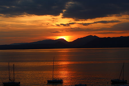 mountain near sea during golden hour thumbnail