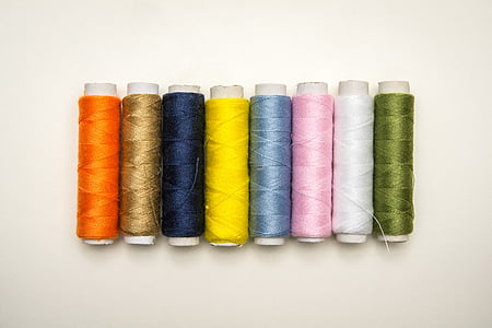 eight thread rolls on white platform thumbnail