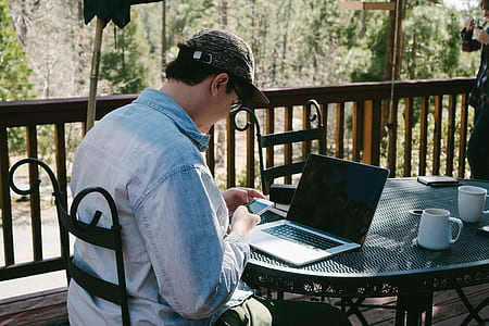 man sitting using smartphone thumbnail