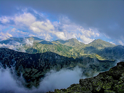 green mountain under blue and white sky during daytime thumbnail