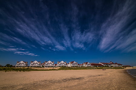 white houses near seashore thumbnail