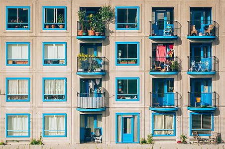 white and blue concrete building during daytime thumbnail