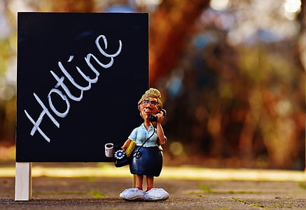 woman with teal shirt and blue skirt using rotary telephone figurine illustration thumbnail