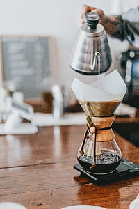 person pouring coffee from pot thumbnail