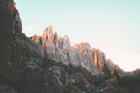 low angle photo of brown rock formation during daytime thumbnail