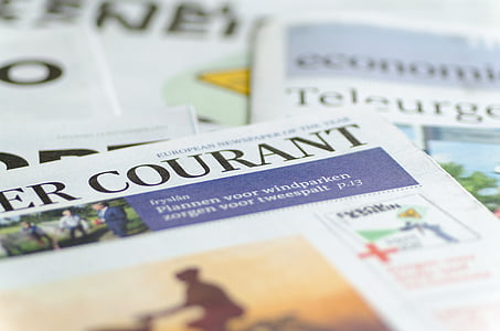 shallow focus photography of newspaper thumbnail