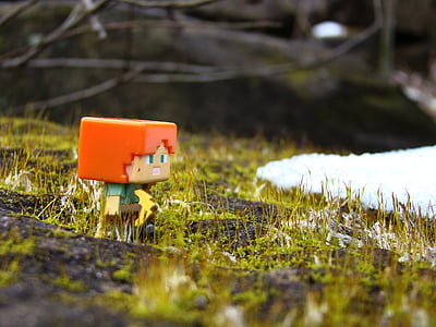 mini figure on grass next to snow thumbnail