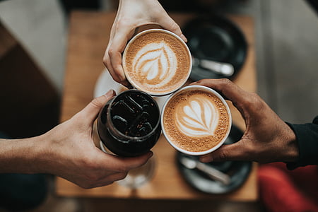 three person holding cups thumbnail