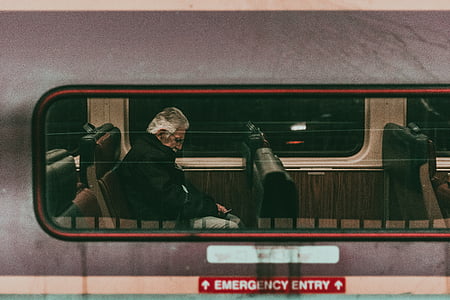 man sitting inside vehicle thumbnail