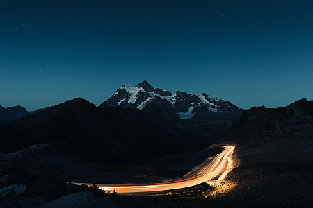 black and white mountain photo during night time thumbnail