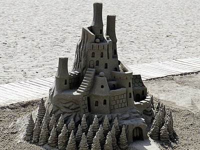 sand castle placed beside beige wooden platform thumbnail