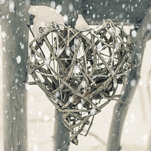 wicker heart decor with snowflakes falling thumbnail