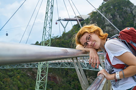 woman leaning on grey steel frame thumbnail