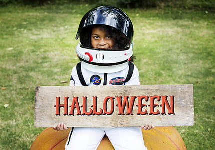 Girl Holding Halloween Decor thumbnail
