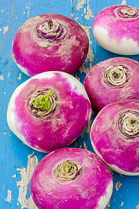 six red onions on blue wooden surface thumbnail