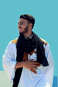 man in black and white traditional dress thumbnail