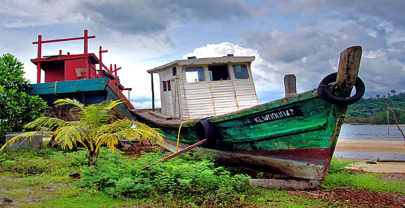 photography of boat on land thumbnail