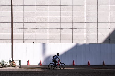 man riding bicycle on road thumbnail
