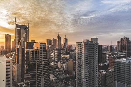 bird's eye photography of high rise buildings during golden hour thumbnail