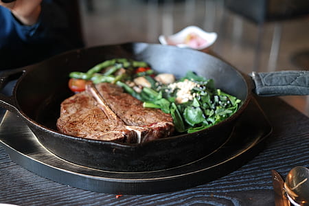 photo of black frying pan with brown meat thumbnail
