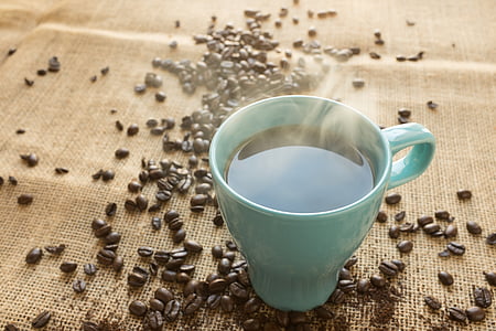 white ceramic coffee mug with brown coffee beans thumbnail