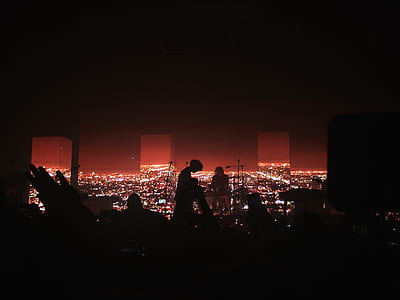 silhouette of man sitting on stage thumbnail