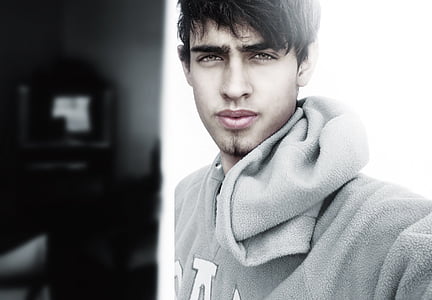 closeup of man wearing gray hooded jacket thumbnail
