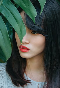 Photo of Woman Near Plant thumbnail