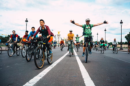 men cycling on asphalt road thumbnail