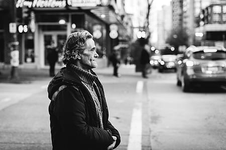grayscale photo of man on street thumbnail