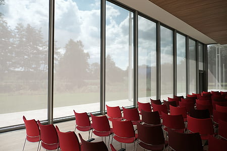 red chair lot inside room beside glass window thumbnail