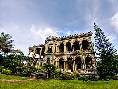 man's eye view of mansion near trees thumbnail