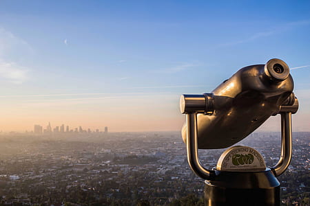 aerial photography of telescope looking downward city skyline thumbnail