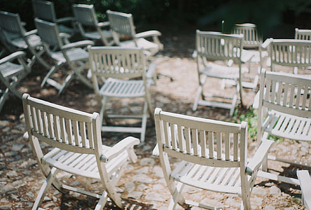 selective focus photography of folding armrest chairs thumbnail
