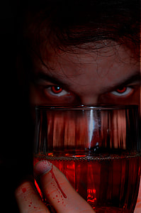 man holding clear glass wine glass thumbnail
