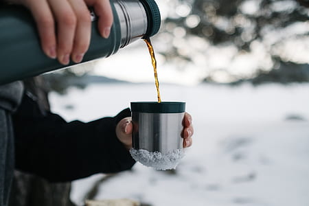 person pouring coffee on cup thumbnail