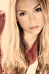 woman with red scoop-neck shirt close-up photo thumbnail