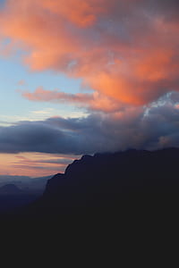 photography of mountain and nimbus clouds thumbnail