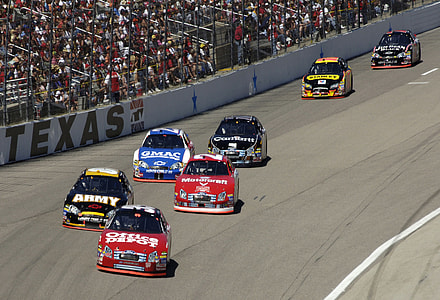 race cars on race track at daytime thumbnail