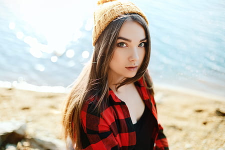 long blonde-haired woman in black and red checkered shirt thumbnail
