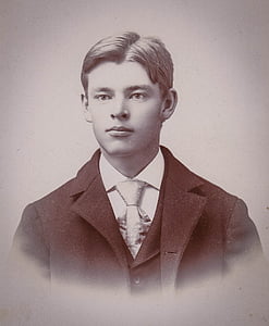 grayscale photo of boy in notched lapel suit jacket thumbnail